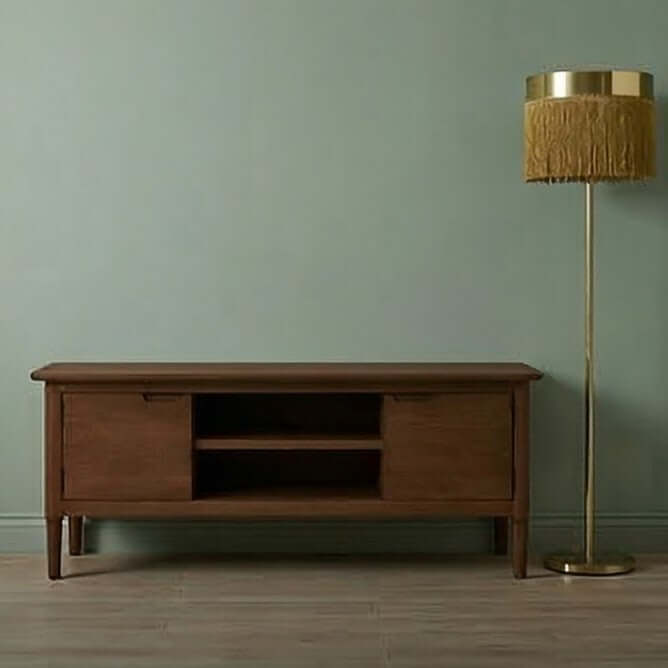 Fishe & Lilly Norway Dark Walnut TV Stand & Media Unit with mid-century design next to a fringed floor lamp.