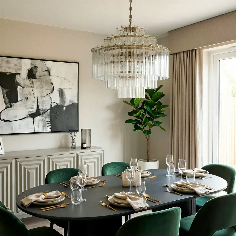 Pooky Astrid Chandelier in Clear Glass hanging elegantly above a stylish dining table setting.