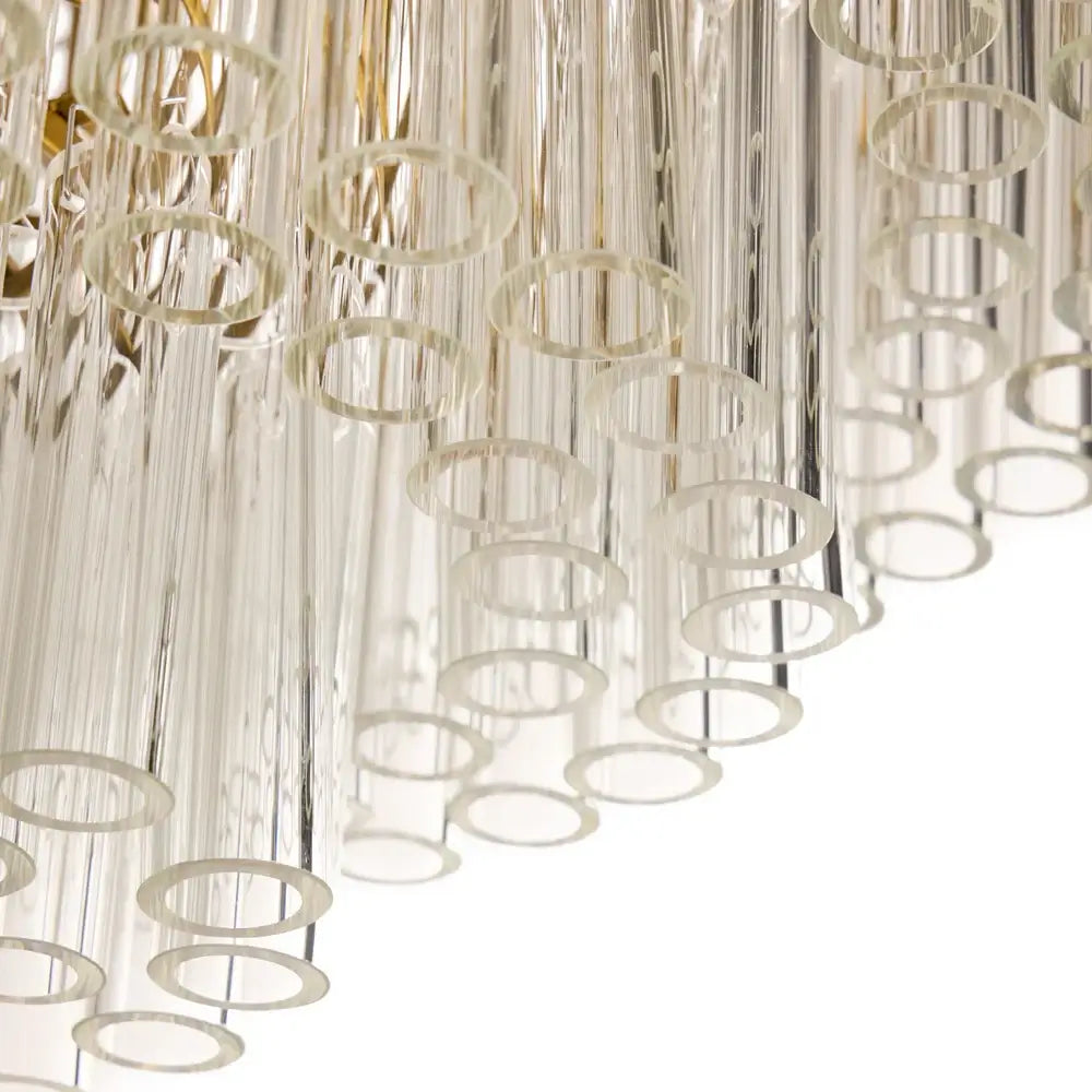 Pooky Astrid Chandelier in Clear Glass featuring elongated glass rods in a cascading design.