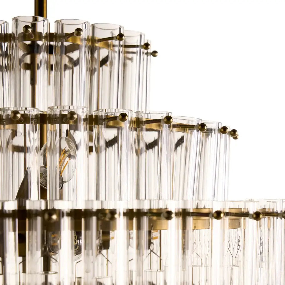 Pooky Astrid Chandelier in Clear Glass showcasing intricate glass rod design and elegant gold accents.