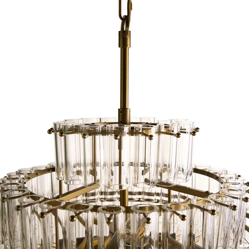 Pooky Astrid Chandelier in Clear Glass featuring elongated glass rods and a brass finish.