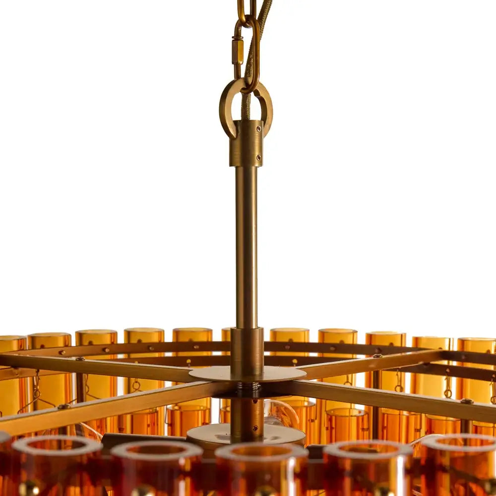 Pooky Chiara Chandelier in Amber Glass showcasing warm brass fittings and amber glass tubes.