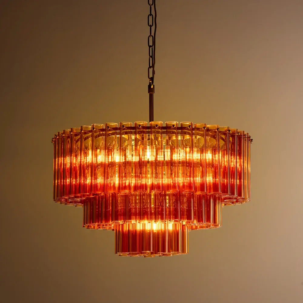 Pooky Chiara Chandelier in Amber Glass showcasing amber glass tubes and warm brass fittings.