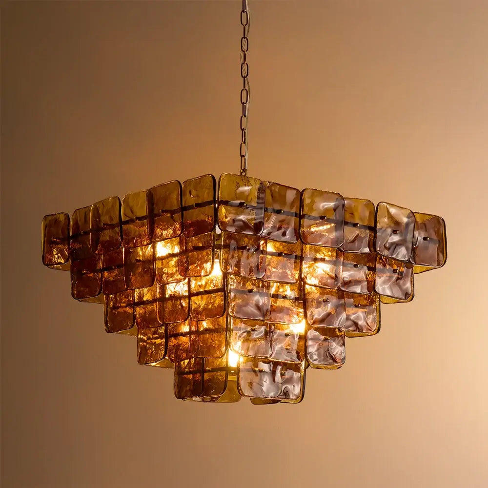 Pooky Havana Chandelier in Deep Brown with layered glass tiles and warm lighting against a neutral background.