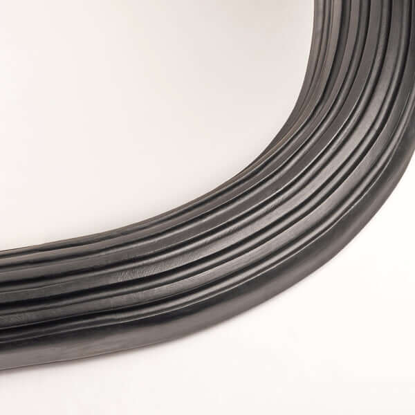 Pooky - Benedict Mirror - Ebony Wood close-up of elegant curved black wooden frame detail.
