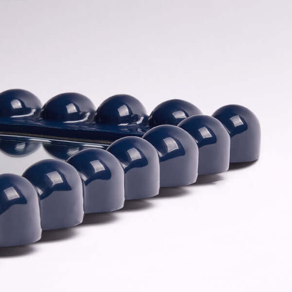 Pooky - Charming Mirror - Navy detailed view of the navy resin frame with playful rounded edges.