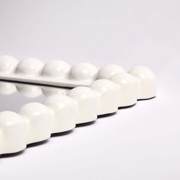 Pooky - Charming Mirror - White features a playful white carved frame with round accents, ideal for stylish decor.