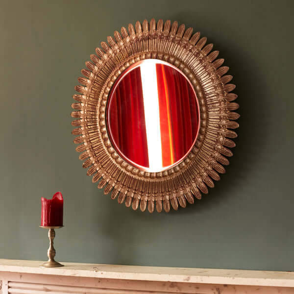 Pooky - Grace Mirror displayed on a wall, featuring a carved wooden frame in distressed gold.