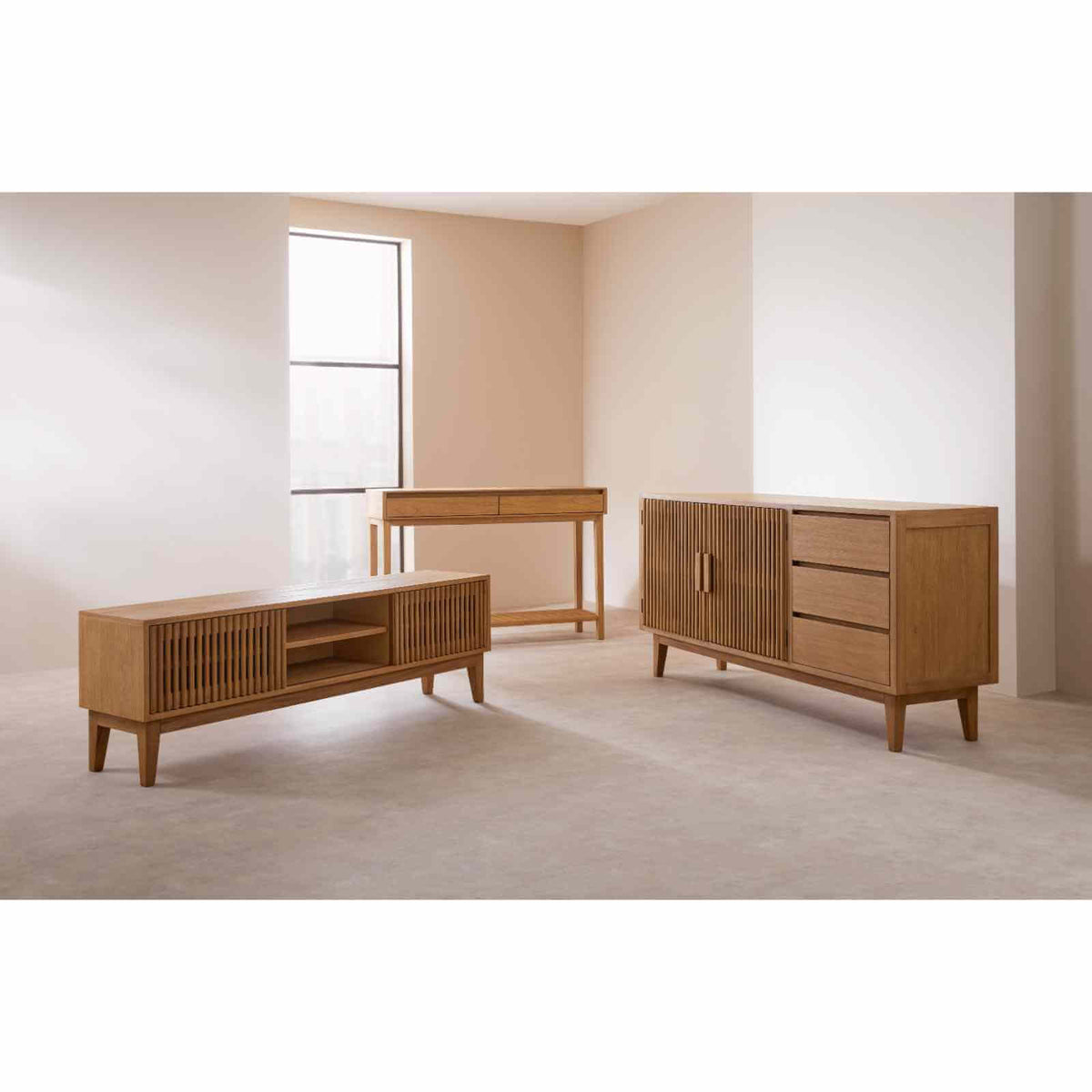 Fishe & Lilly Melia Console Table with Two Drawers shown in a room with a matching hardwood TV unit and slatted sideboard.