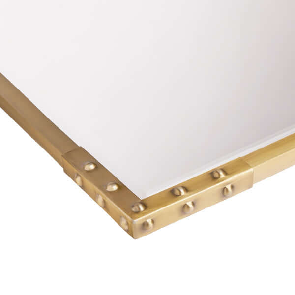 Pooky - Studland Mirror - Brass close-up of elegant brass studded frame detail.