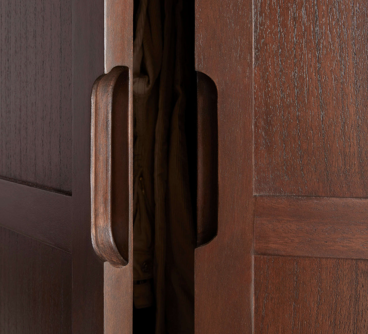 Close-up of the recessed handles on the Fishe & Lilly Norway Dark Walnut Wardrobe, highlighting the rich wood grain.