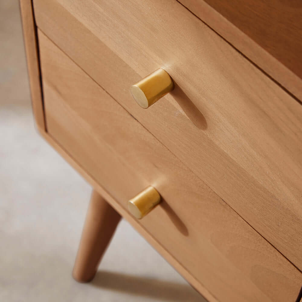 Polished brass drawer pulls on the Fishe & Lilly Scandinavian Light Walnut Logan Narrow Bedside Table