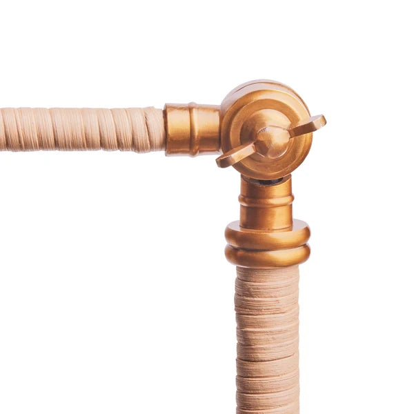 Close-up of the Pooky - Abel Standing Lamp Base - Brass And Natural Rattan - Without Lampshade brass joint.