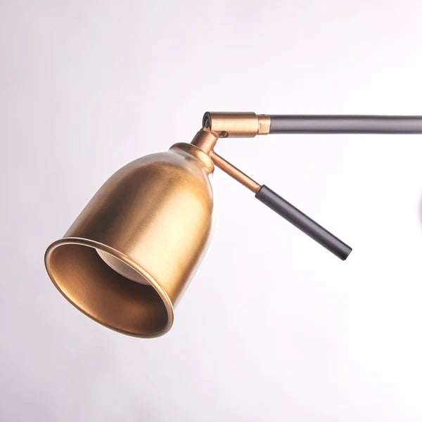 Close-up of the adjustable hood on the Pooky - Pick Reading Lamp - Black And Antiqued Brass.