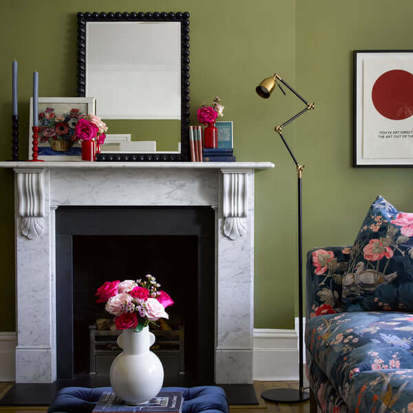 Stylish interior featuring Pooky - Charming Mirror - Navy above a marble fireplace with colorful decor.
