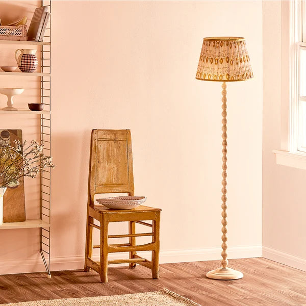 Pooky - Lillee Rechargeable Standing Lamp Base - Cream - Without Lampshade styled next to a chair.