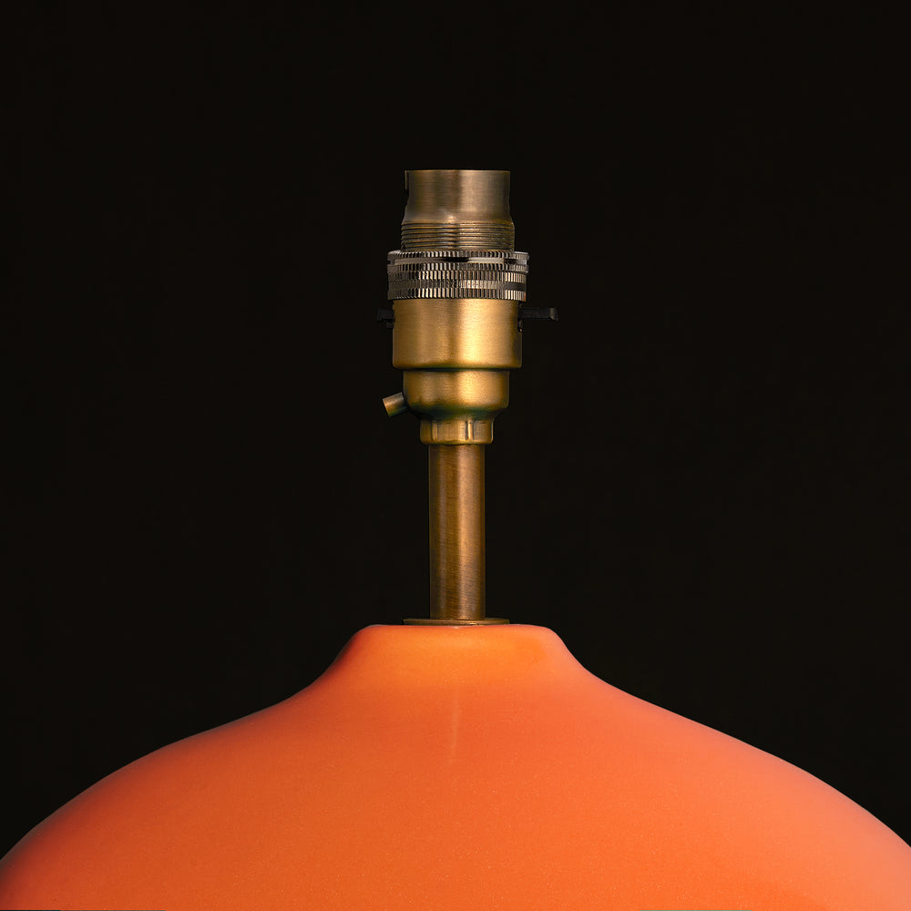 Close-up of the brass fitting on the Pooky - Olly Table Lamp Base - Orange