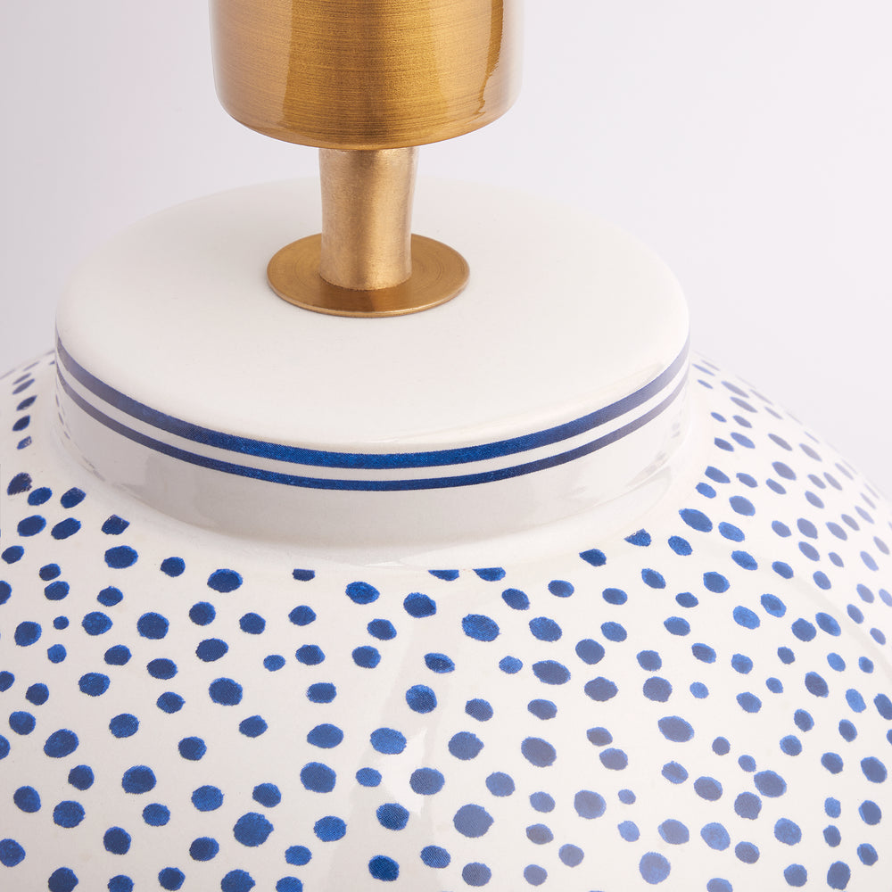 Close-up of Pooky - Polka Table Lamp Base - Blue and White featuring ceramic dot pattern and brass fitting.