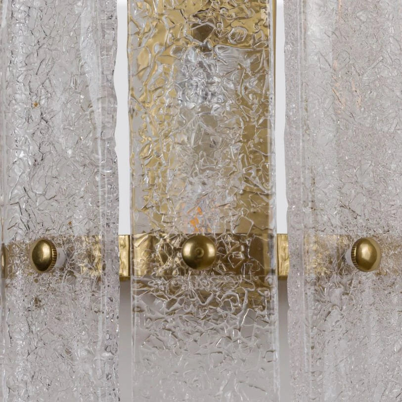 Pure White Lines Tahli wall light close-up showing crackled glass and brass fittings.