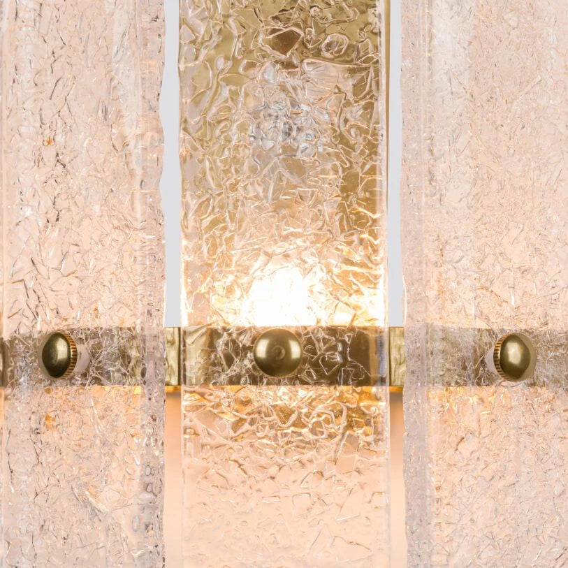 Close up crackled glass detail of the Pure White Lines Tahli wall light with brass fittings.