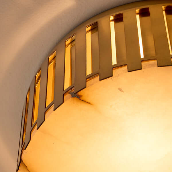 Pooky - Crenel Flush Ceiling Light - Alabaster and Brass close-up of geometric brass design with alabaster glow