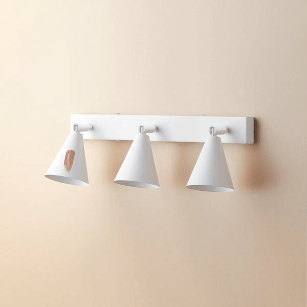 Pooky - Crick Triple Wall Spotlight - Paintable Finish showcased on a wall with paint applied for customization.