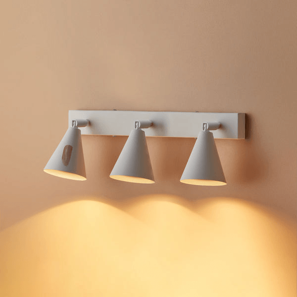 Pooky - Crick Triple Wall Spotlight - Paintable Finish installed on a wall, featuring three adjustable light fixtures.