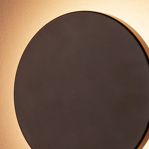 Pooky - Helios Ip44 Wall Light - Smaller - Brushed Bronze Aluminium modern design with a gentle warm glow on the wall.