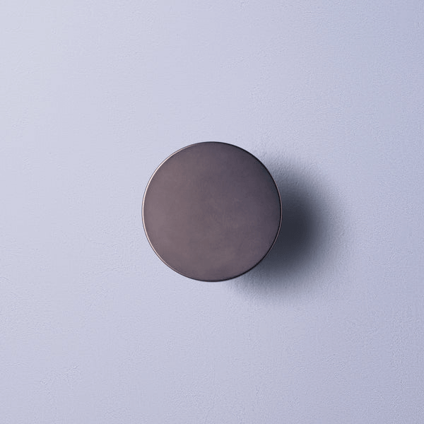 Pooky - Helios Ip44 Wall Light - Smaller - Brushed Bronze Aluminium mounted on a wall.
