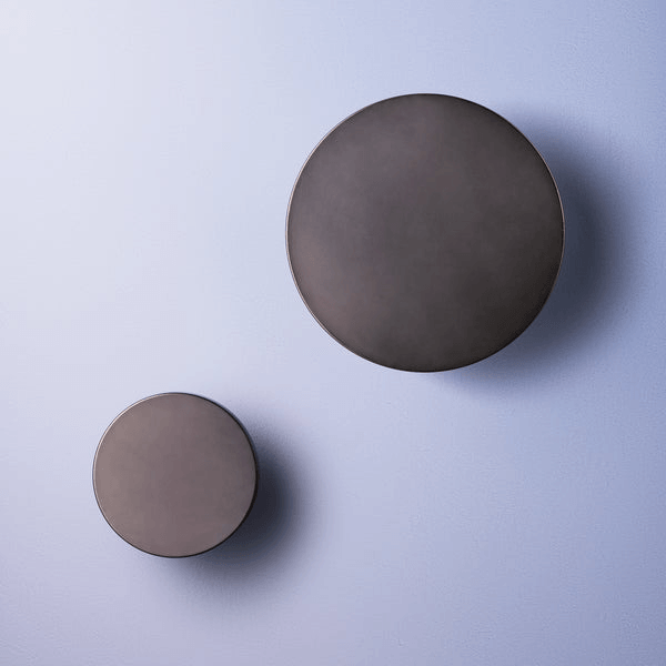 Pooky - Helios Ip44 Wall Light - Smaller - Brushed Bronze Aluminium, modern round wall sconces on a pastel background.
