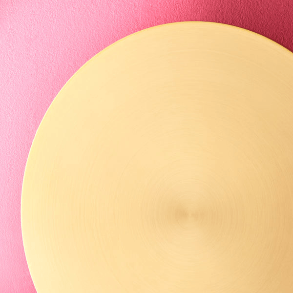 Pooky - Helios Ip44 Wall Light - Larger - Brushed Gold Aluminium on a pink background.