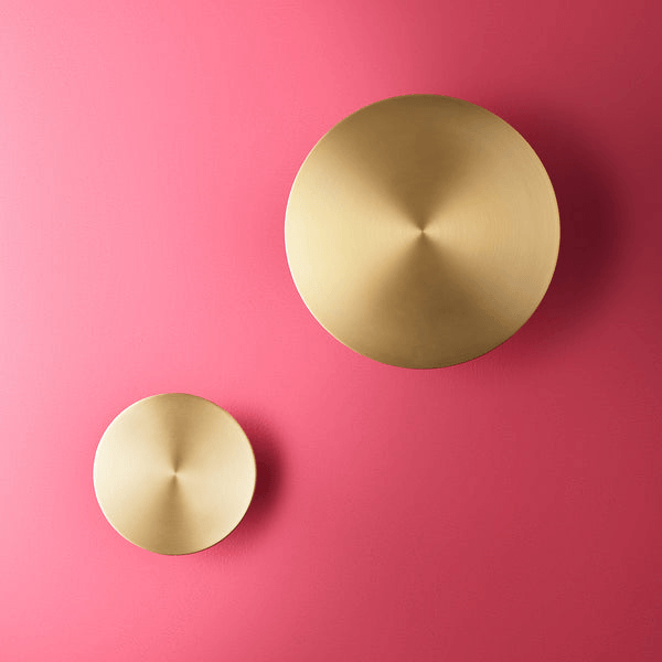 Pooky - Helios Ip44 Wall Light - Larger - Brushed Gold Aluminium on a pink wall background