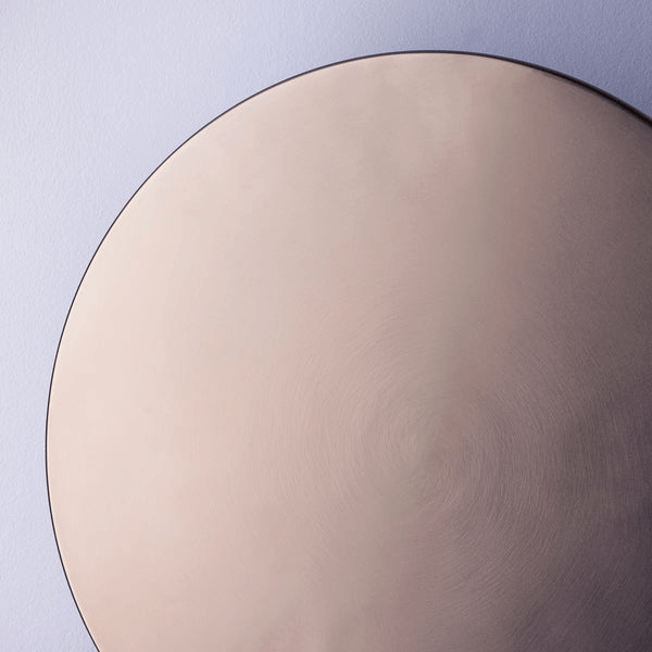 Pooky - Helios Ip44 Wall Light - Largest - Bronze Aluminium close-up of the circular bronze finish against a lavender wall.