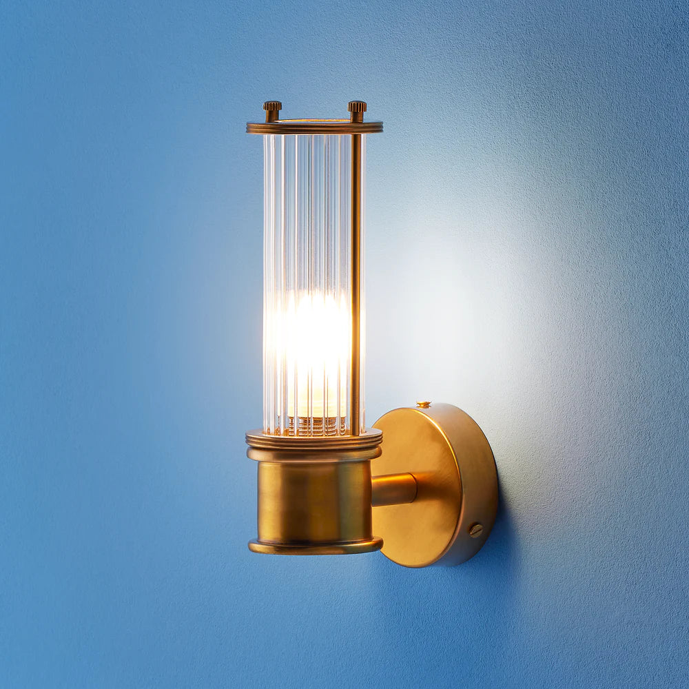 Pooky Hunter IP44 wall light in brass and glass
