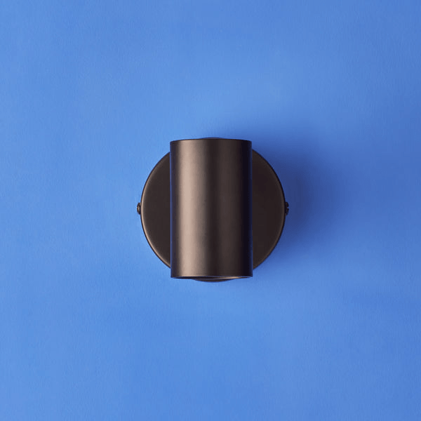Pooky - Lewis single Wall Light - Black - With switch mounted on a blue background