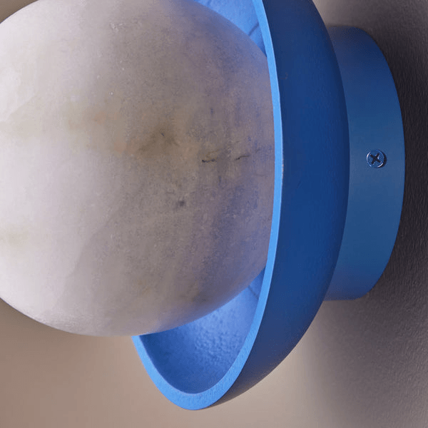 Pooky - Luna Wall Light - Klein Blue featuring a soft alabaster globe in a blue ceramic dish.