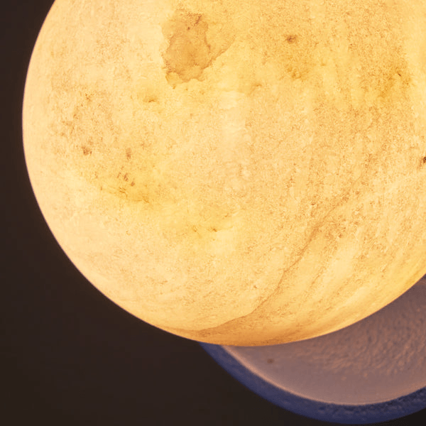 Pooky - Luna Wall Light - Klein Blue alabaster globe detail with warm glow and ceramic base.