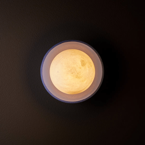 Pooky - Luna Wall Light - Klein Blue viewed from above showing the soft glow of the alabaster globe.