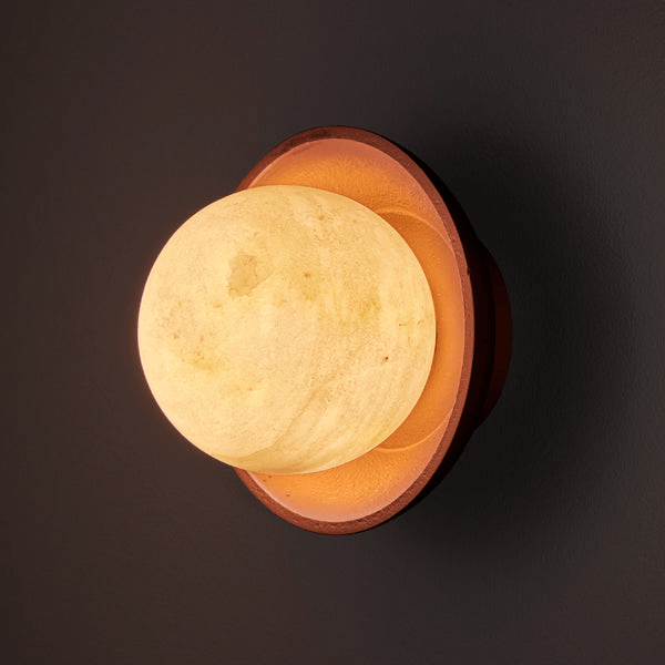 Pooky - Luna Wall Light - Terracotta Finish mounted on a wall, featuring a soft alabaster globe.