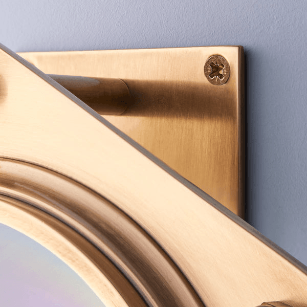 Pooky - Poirot Wall Light - Brass And Glass close-up showing elegant brass mount and design details.