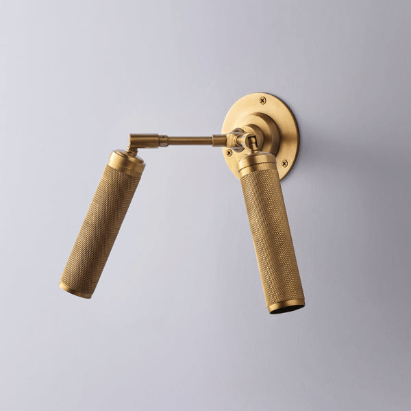 Pooky - Quantum Double Wall Light - Antiqued Brass, featuring knurled spotlights and elegant design.