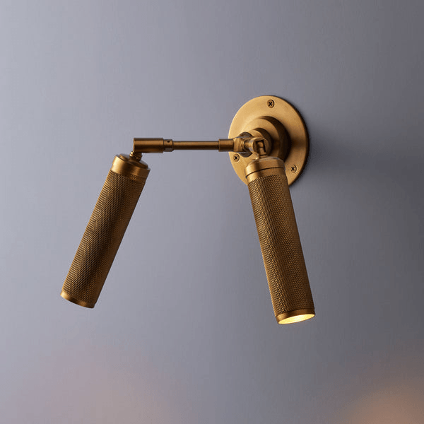 Pooky - Quantum Double Wall Light - Antiqued Brass with knurled detailing and dual spotlights.