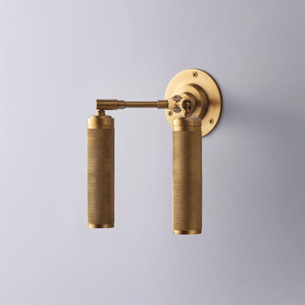 Pooky - Quantum Double Wall Light - Antiqued Brass featuring knurled spotlights in brass finish.
