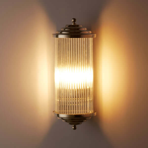 Pooky - Deco Baby Roddy ip44 rated Wall Light - Nickel with Glass Rods illuminating a wall with stylish design.