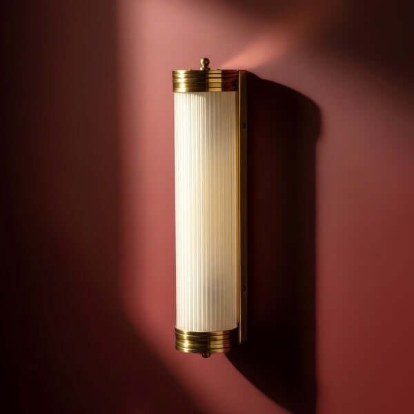 Pooky - Long Roddy ip44 Wall Light - Brass and Frosted Glass mounted on a wall.