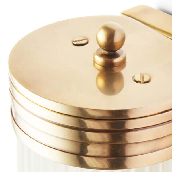 Close-up of the elegant brass top of the Pooky - Long Roddy ip44 Wall Light - Brass and Frosted Glass.