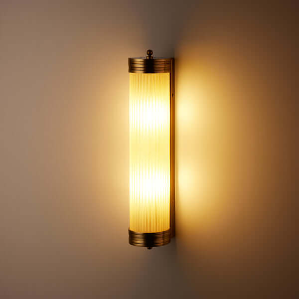Pooky - Long Roddy ip44 Wall Light - Brass and Frosted Glass illuminating a wall with elegant design.