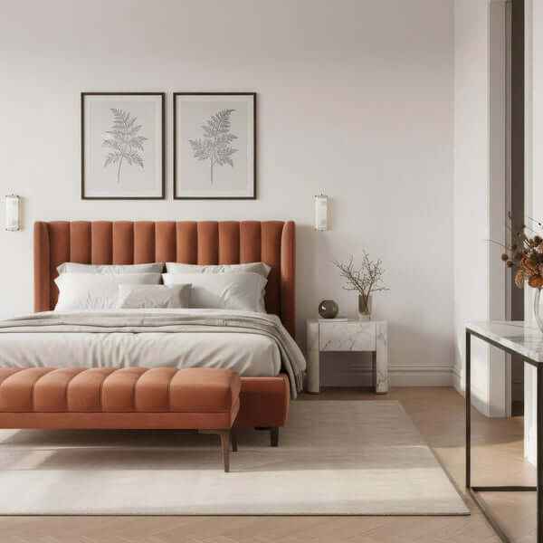 Stylish bedroom featuring a modern orange tufted bed frame, elegant decor, and wall art.
