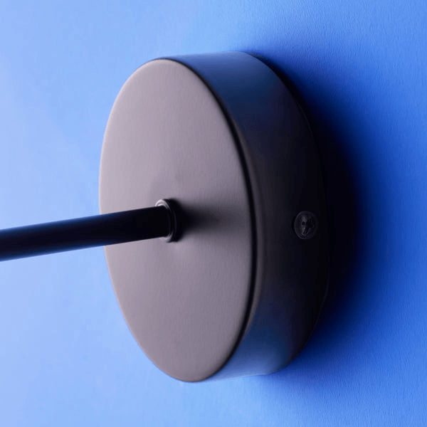 Pooky - Sway Wall Light - Black wall mount detail on a blue wall.