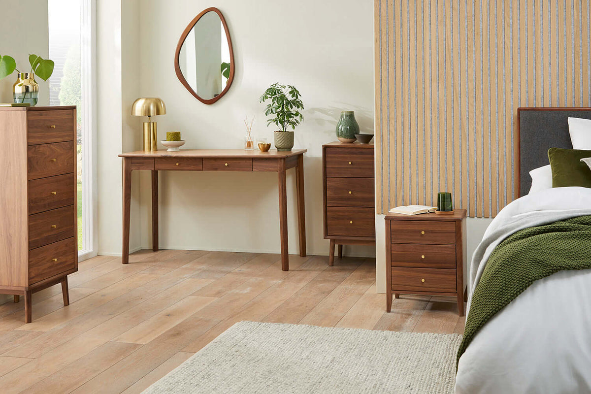 Fishe & Lilly Wright Walnut Desk and Dressing Table with dark walnut finish in a bedroom.